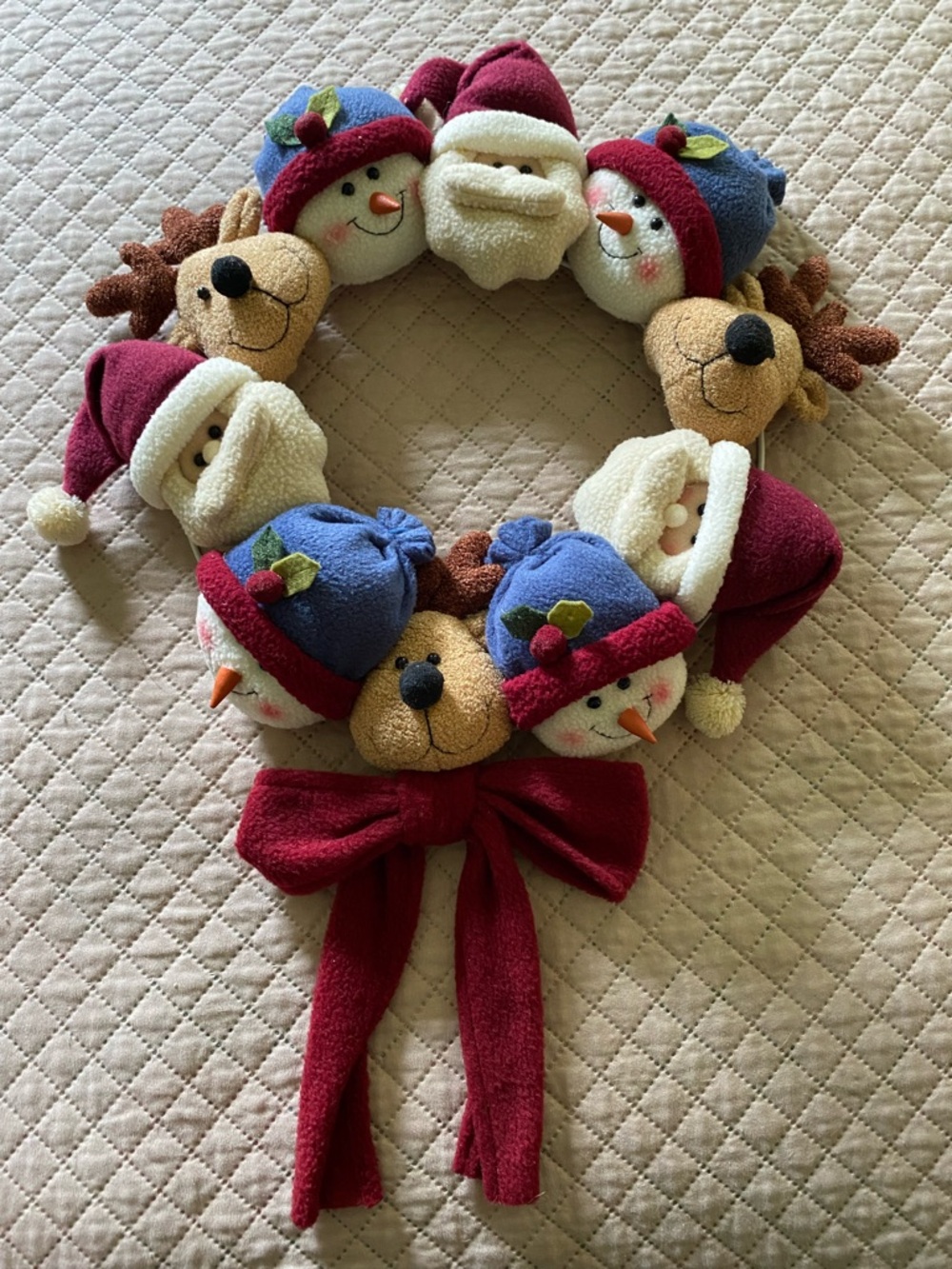 Plush Holiday Wreath with Snowman, Reindeer & Santa Faces - Red & Blue